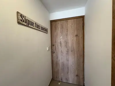 a room with a wooden door and a sign on the wall at Luxury mediterranean Suite in Cartagena de Indias
