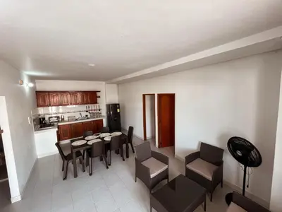 a kitchen and dining room with a table and chairs at Madili del Mar II in Santiago