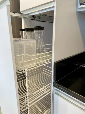 an empty refrigerator with its door open with dishes inside at Lujo y espacio Bello Horozonte gran apartamento hasta 10 personas in Santa Marta