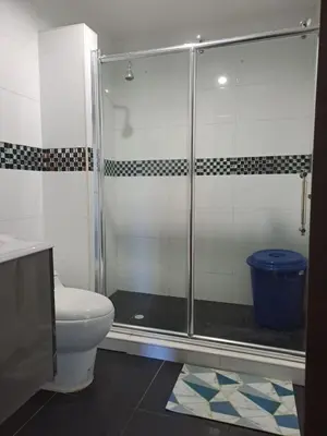 a bathroom with a shower and a toilet at Hermosa Cabaña C15, Castillo Club in Coveñas