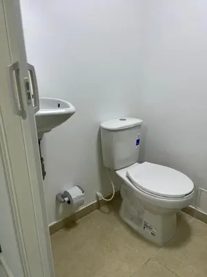 a bathroom with a toilet and a sink at Habitación cerca a la playa 104 in Cartagena de Indias