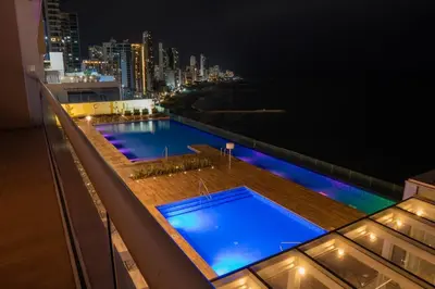 a large swimming pool on top of a building at night at Disfruta el espectáculo de la bahía in Cartagena de Indias