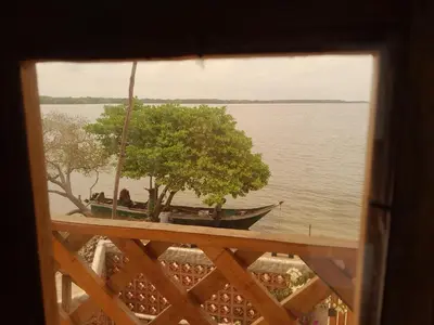 a view from a window of a boat on the water at Cabaña Barbacoas in Santa Ana