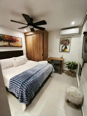 a bedroom with a bed and a ceiling fan at Apartamento Luxury en Cartagena con Vista al mar in Cartagena de Indias