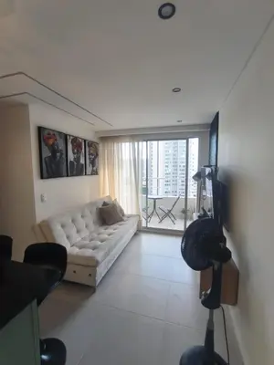 a living room with a couch and a large window at Apartamento Luxury en Cartagena con Vista al mar in Cartagena de Indias