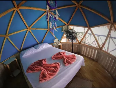 a room with a bed in a yurt at Hostal Ananda in Playa Blanca