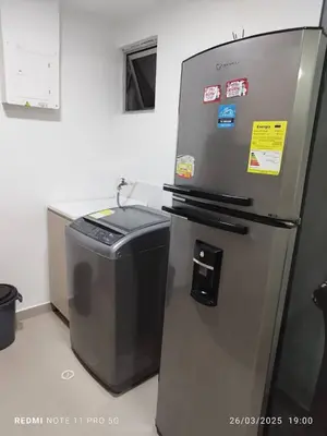 a refrigerator and a trash can in a kitchen at Apartamento turístico cerca al mar en Cartagena in Cartagena de Indias