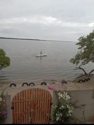 a person in a boat on the water at Cabaña Barbacoas1 in Santa Ana