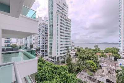 an apartment balcony with a view of a city at Apartamento con vista al mar - Piscina en la azotea - 2 habitaciones + 2 baños in Cartagena de Indias