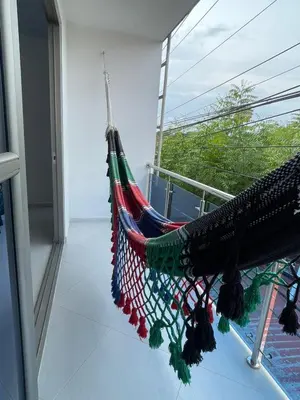 a hammock on a balcony in a room at Apartamento Salome in Coveñitas
