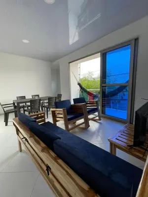 a living room with a couch and a large window at Apartamento Salome in Coveñitas