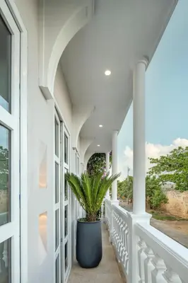 a porch with a potted plant on it at Hotel Casa Sonara in Cartagena de Indias