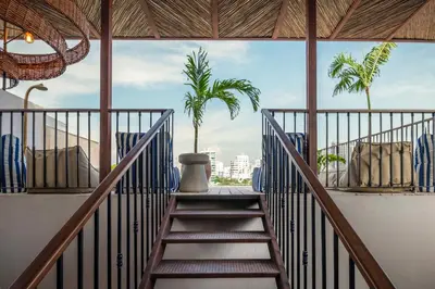 a staircase leading up to a room with palm trees at Hotel Casa Sonara in Cartagena de Indias