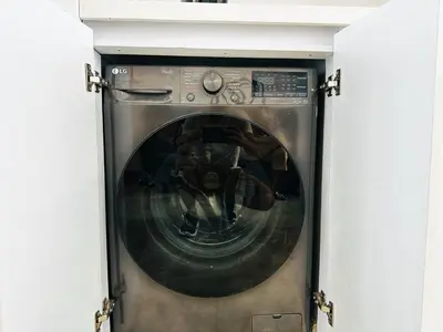 a washing machine with its door open in a room at Amazing loft - 2 minutes from the airport! in Cartagena de Indias