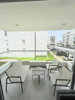 a room with chairs and tables and a large window at Hermoso apartamento serena del mar #1 in Puerto Tierrabaja