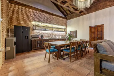 a kitchen and dining room with a table and chairs at Casa D Boutique in Cartagena de Indias