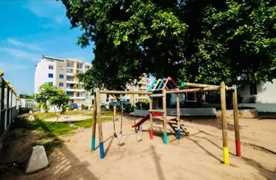 a playground in a park with a swing set at Apartamento en Barranquilla in Barranquilla