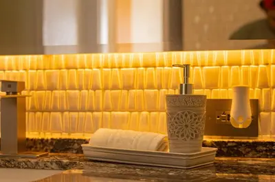a bathroom counter with a soap dispenser and a towel at Luxury Ocean View Apartment Building H2 - Hyatt in Cartagena de Indias