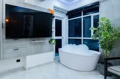 a bath tub in a living room with a tv at Luxury Apartment BayView Jacuzzi Guestfriendly in Cartagena de Indias