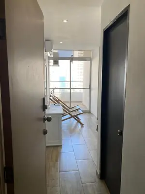 a hallway with a door leading to a room at Departamento con vista al mar in Cartagena de Indias