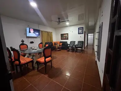 a living room with a table and chairs at Cabañas villa Ángela in Coveñas