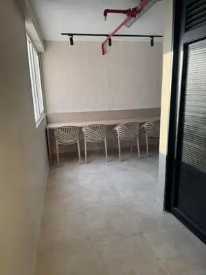 a row of chairs in a room with a table at Apto refugio del mar in Cartagena de Indias