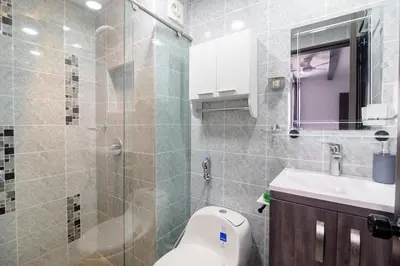 a bathroom with a toilet and a sink and a shower at Apt luxury near sea wifi Ac pool at Cartagena in Cartagena de Indias