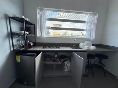 a small kitchen with a sink and a window at Atardeceres casa de playa in Cartagena de Indias