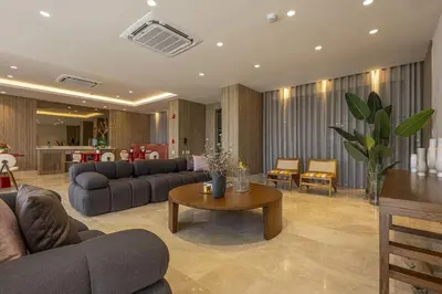 a living room with couches and a coffee table at Beachfront Stay Morros EOS in Cartagena de Indias