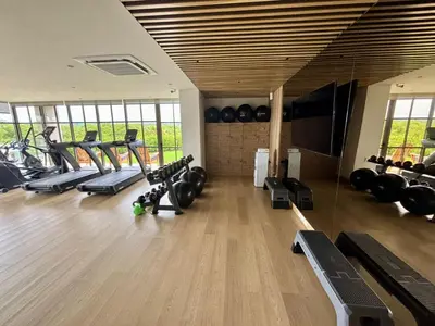 a gym with several treadmills and cardio machines at Beachfront Stay Morros EOS in Cartagena de Indias