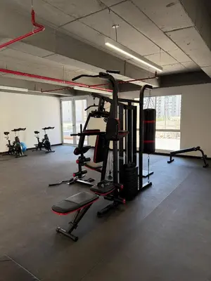 a gym with several tread machines in a room at Luxury Apartments in Barranquilla