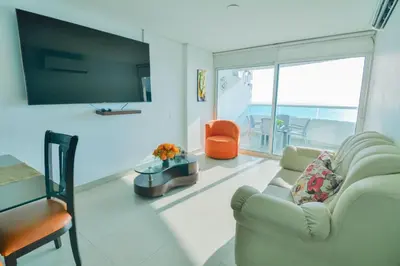 a living room with a couch and a chair at Alojamiento en Torres del Lago in Cartagena de Indias