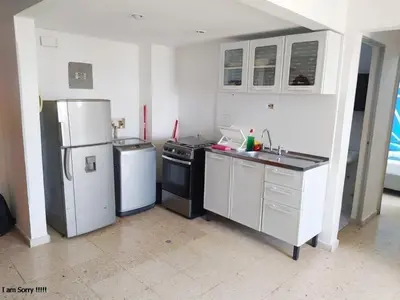 a kitchen with a refrigerator and a stove and a sink at alojamiento frente mar 11 in Cartagena de Indias