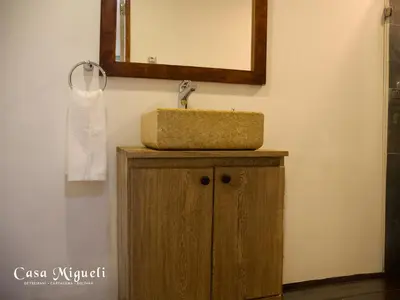 a bathroom with a sink and a mirror at Casa Migueli, exclusiva casa con jacuzzi en terraza in Cartagena de Indias