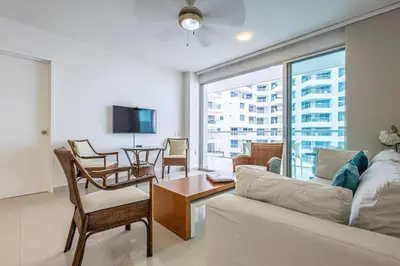 a living room with a couch and a table at Clifford Place Morros epic - Direct Beach Access in Cartagena de Indias