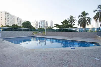 a swimming pool in a city with tall buildings at Riviera del Mar - Apartamento con vista panorámica al mar in Cartagena de Indias