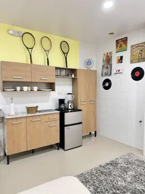a kitchen with several tennis rackets on the wall at aparta estudio susheria in Sincelejo