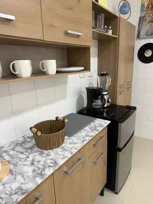 a kitchen with a stove and a counter top at aparta estudio susheria in Sincelejo
