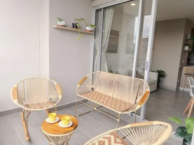 a room with three chairs and a table with cups on it at Maranta Beach in Santa Marta