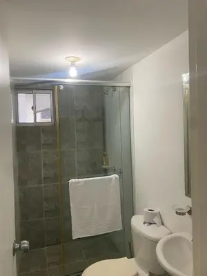 a bathroom with a shower and a toilet and a sink at Playa Azul in Puerto Colombia