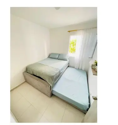 a bedroom with two beds and a window at apartamento lindo in Cartagena de Indias