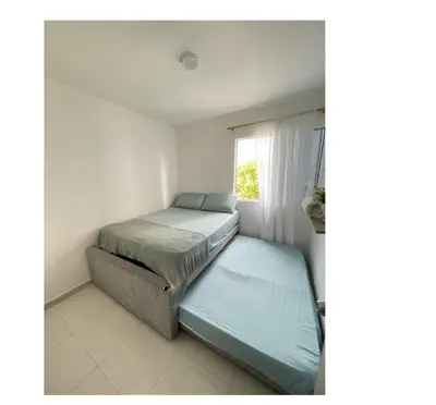 a small bedroom with a bed and a window at apartamento lindo in Cartagena de Indias