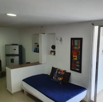 a bedroom with a blue bed in a room at Apartamento con balcon p13 in Cartagena de Indias