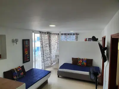 a bedroom with a bed and a window at Apartamento con balcon p13 in Cartagena de Indias
