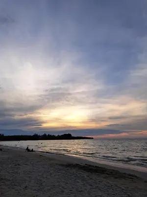 a person laying on the beach at sunset at Tundsya in San Antero