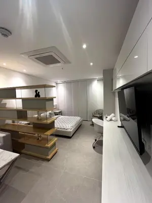 a bedroom with a bed and a television in it at Apto 305 Distrito 90 in Barranquilla