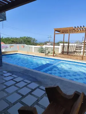 a swimming pool on the roof of a house at Cabaña Eterno Nirvana in Santa Veronica