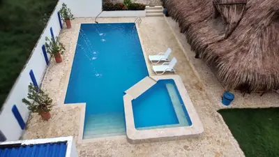 an overhead view of a swimming pool with two lounge chairs at Finca Villa Gabriela