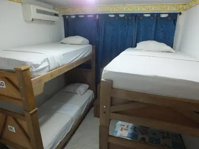 two bunk beds in a small room with at Hotel Nuevo Horizonte in Barranquilla