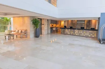 a lobby of a hotel with a reception desk at Sonesta Resort Apartamento Morros Cartagena in Cartagena de Indias